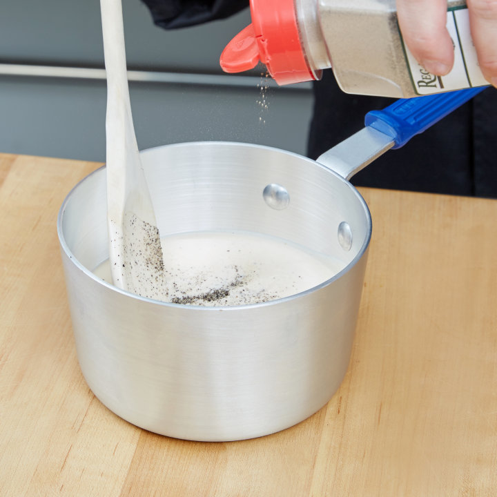 1 ½-quart Wear-Ever® tapered saucepan with natural finish and Cool Handle® rubber grip sleeve