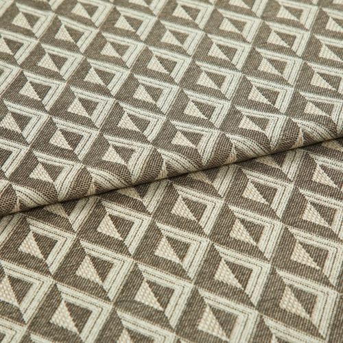 Woven upholstery fabric with repeating cream and brown triangular geometric pattern; folded across the middle, lying flat; close-up studio lighting emphasizes texture and tight weave.