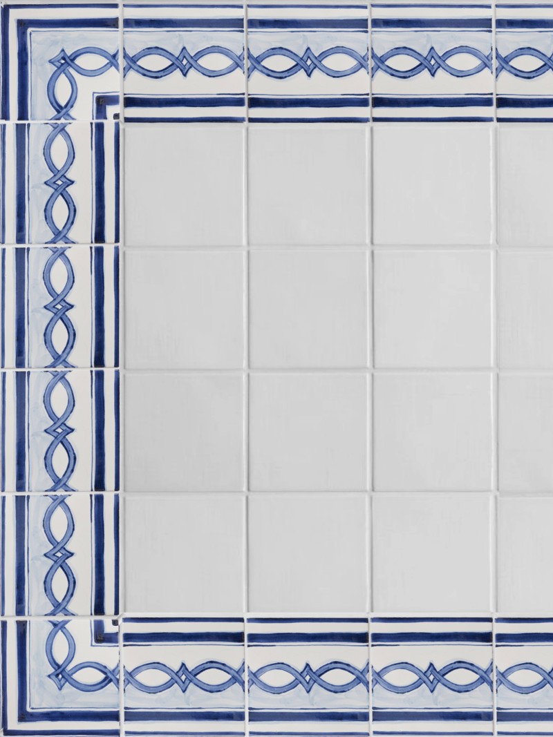 blue and white tiles arranged into an ornate border pattern.
