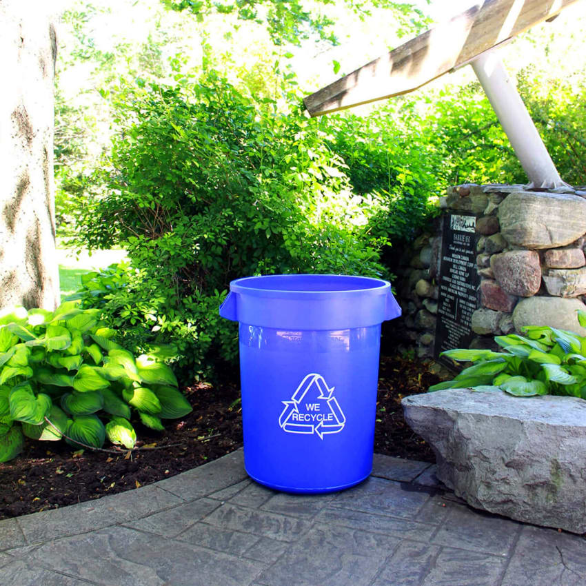large blue plastic bin for collecting recyclables at a city park