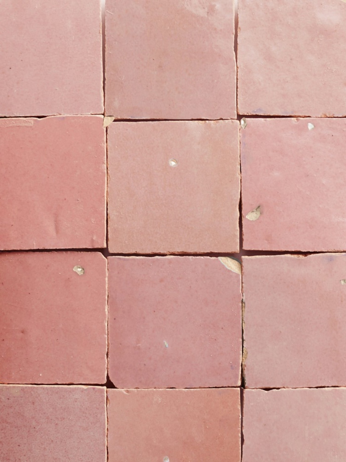 a close up image of pink tiles.