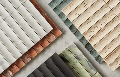 a variety of different colored tiles are laid out on a table.