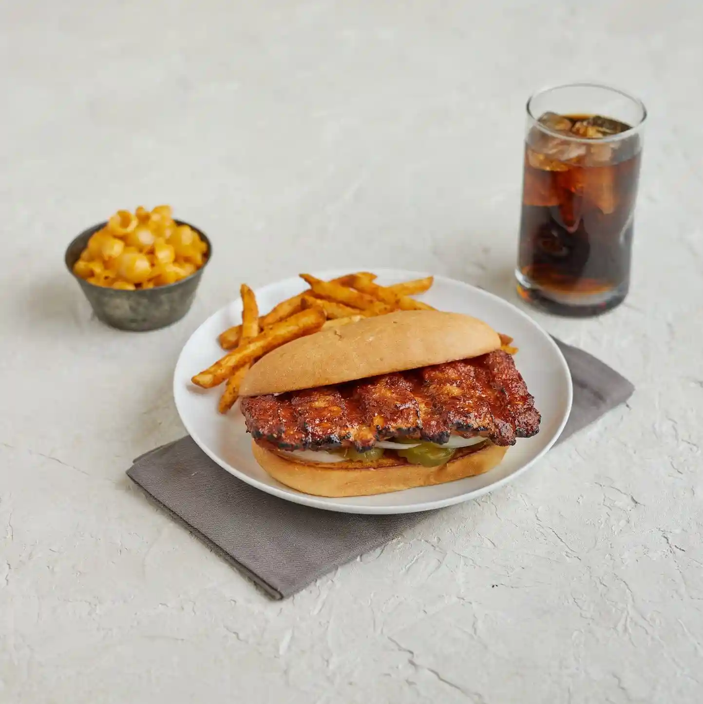 Fully Cooked Boneless Rib Shaped Pork Patties W/BBQ Sauce  3.5 oz, 183 Pieces per case, 40 Lbs https://images.salsify.com/image/upload/s--LzleSOU6--/q_25/szqwgdczrxtwaysvulrd.webp