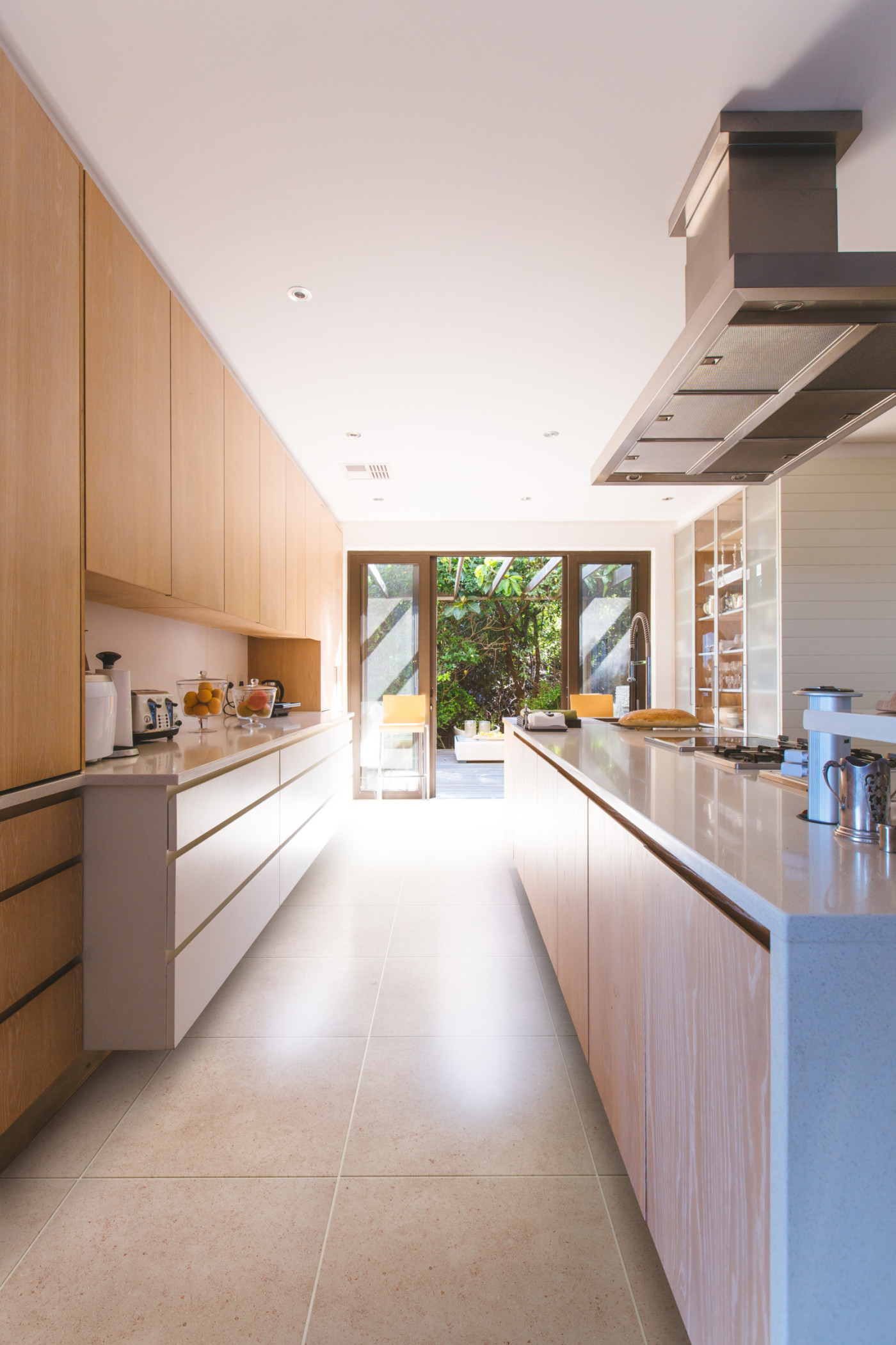 a modern kitchen with wooden cabinets.