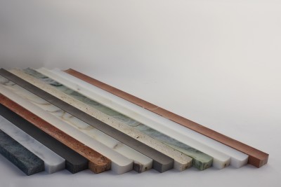 a row of different colored marble slabs on a white surface.
