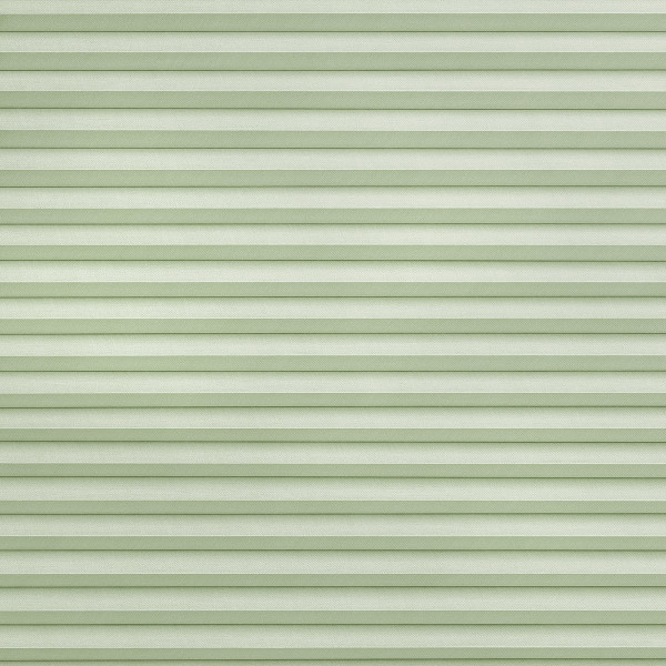 Light green pleated cellular shades spanning the frame, fully lowered and closed with horizontal ribbed texture, softly filtering diffuse daylight into a neutral, softly lit interior.
