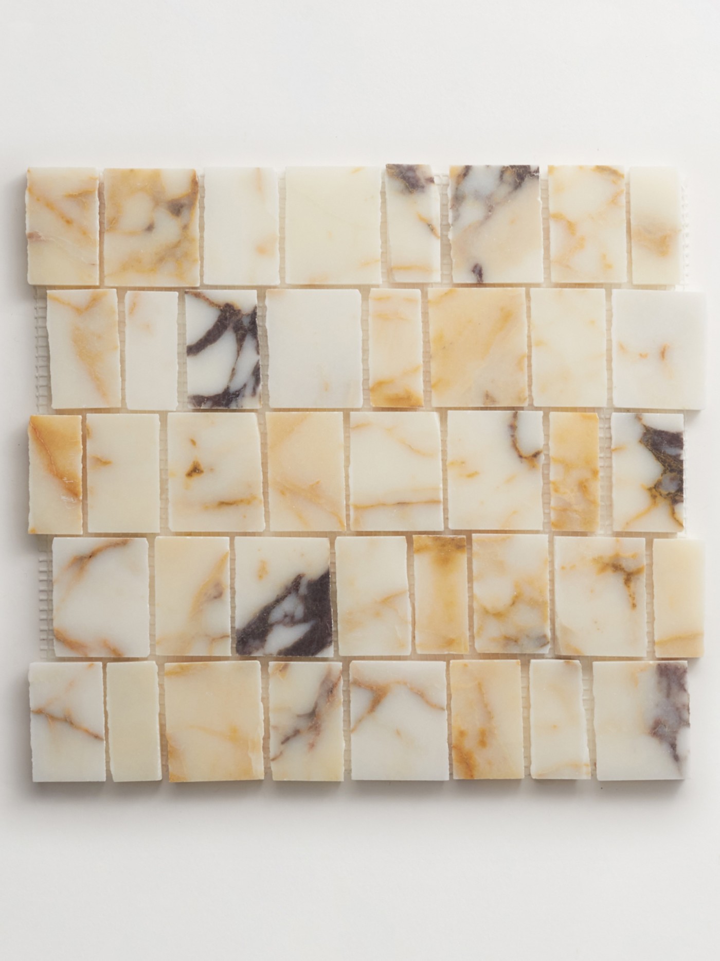 a white marble mosaic tile on a white surface.