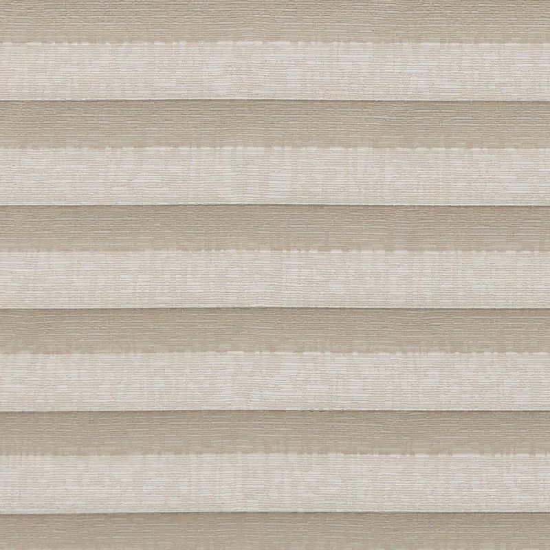 Pleated double-layered cellular shades, horizontal beige and ivory bands, lowered and closed, softly diffusing light; close-up view showing textured fabric panels across a neutral interior setting.