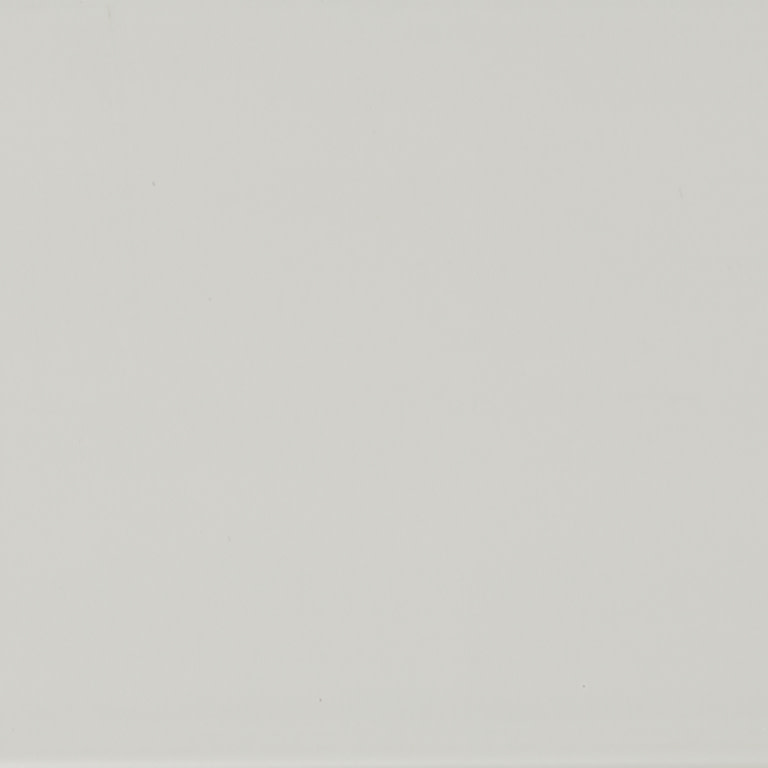 Plain pale off-white surface fills the frame, evenly lit; minimal texture and soft diffuse lighting, no visible fixtures or distinguishing features suggesting room or view.