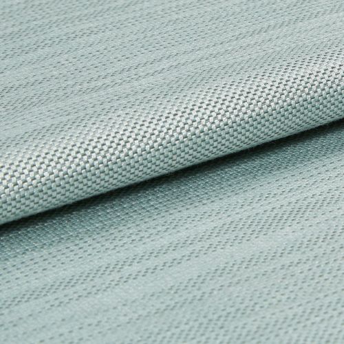 Light blue woven fabric with tight basketweave texture, folded across the frame creating an overlapping edge; close-up studio shot with soft, even lighting and shallow depth of field.
