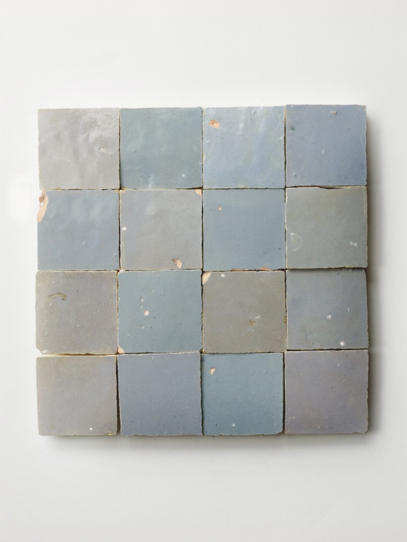 square blue tiles on a white surface.