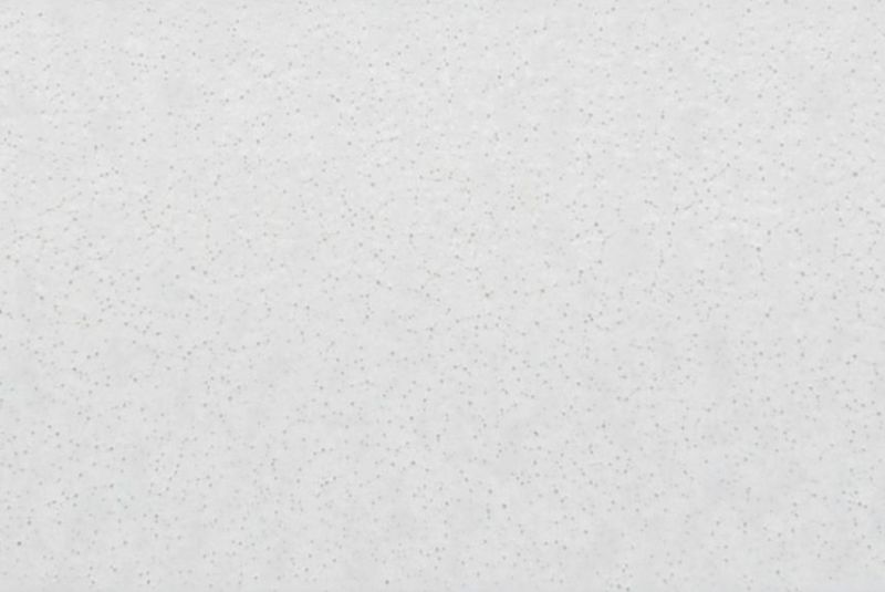 White acoustic ceiling tile with small gray speckles, mounted flush overhead, forming a continuous textured ceiling surface in a softly lit interior with even diffuse lighting and no visible fixtures.