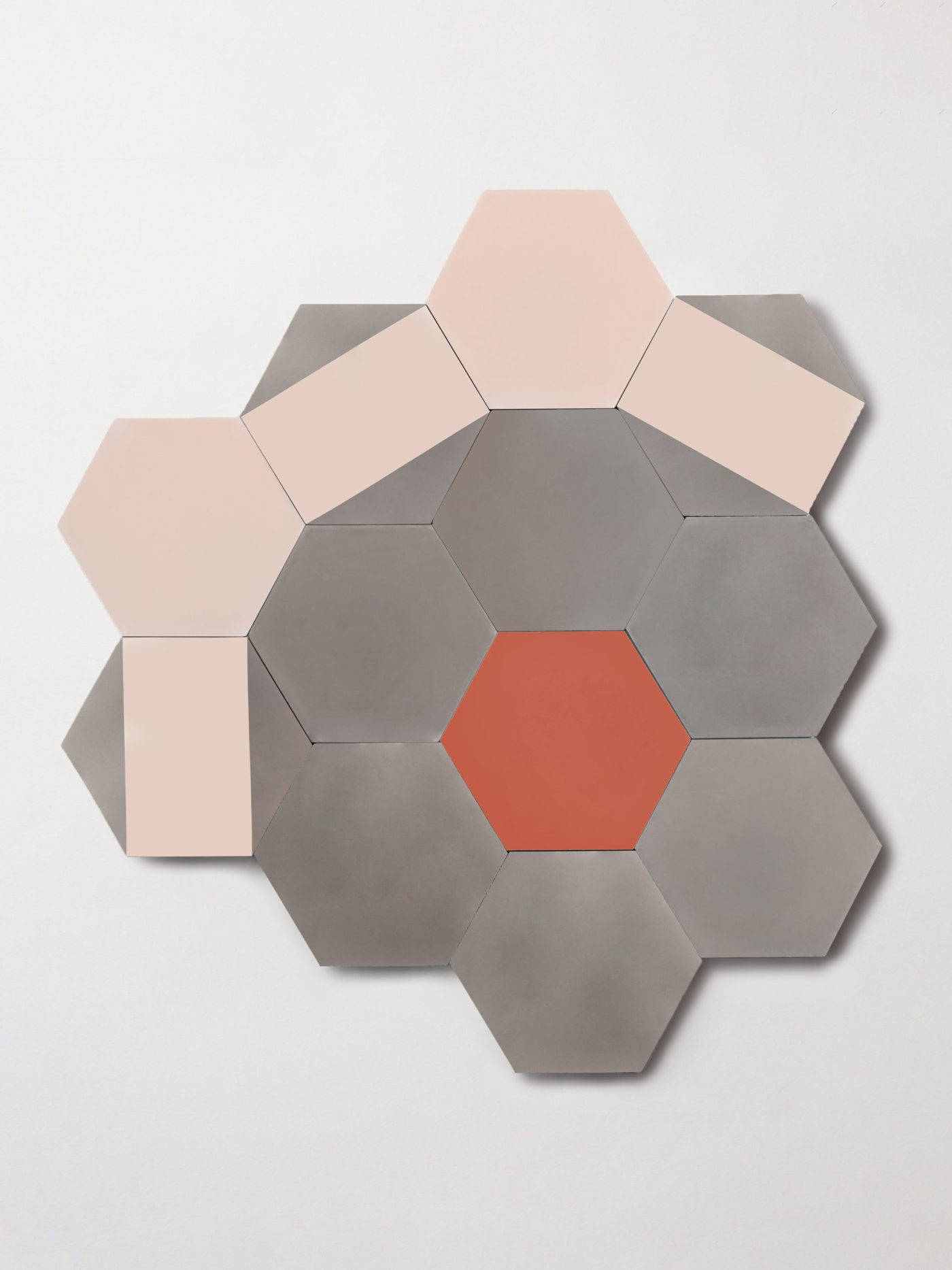 a set of pink, grey, and red tiles forming a pattern on a white background.