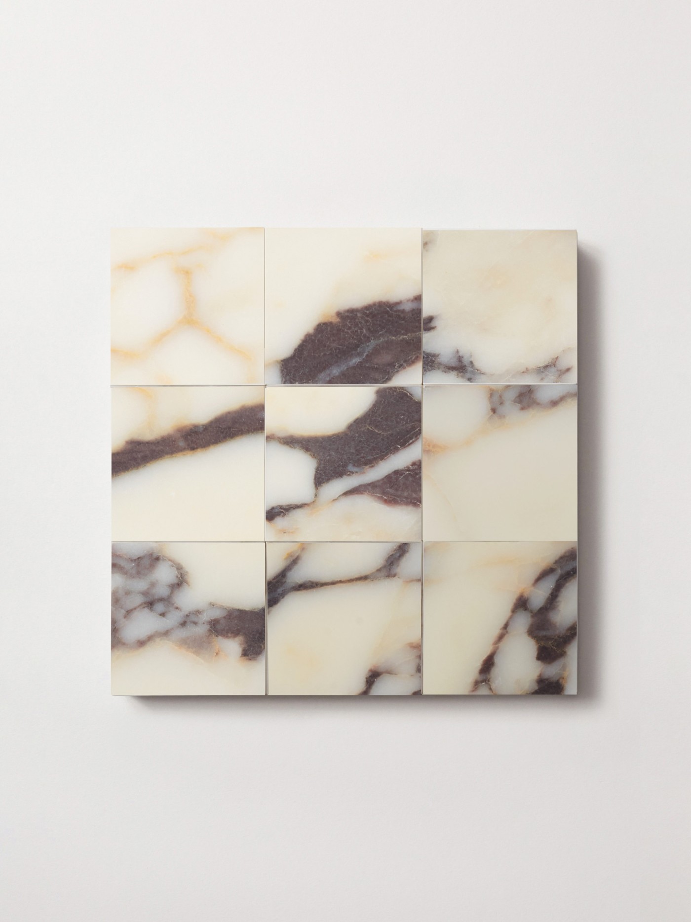 marble tiles arranged on a white surface.