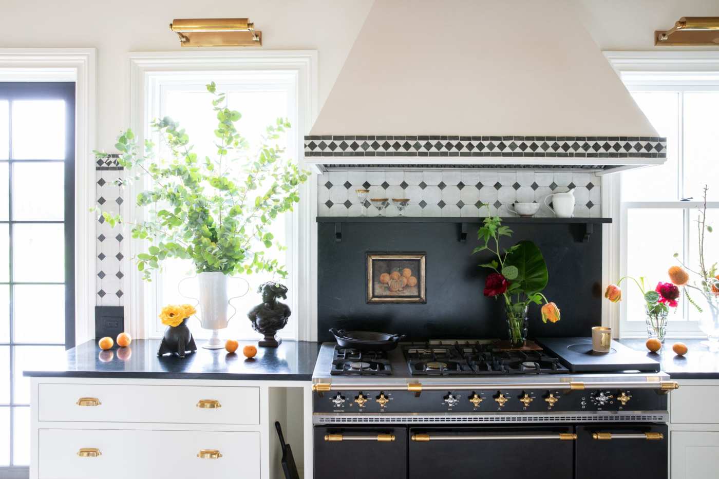 a kitchen with a black and gold stove.