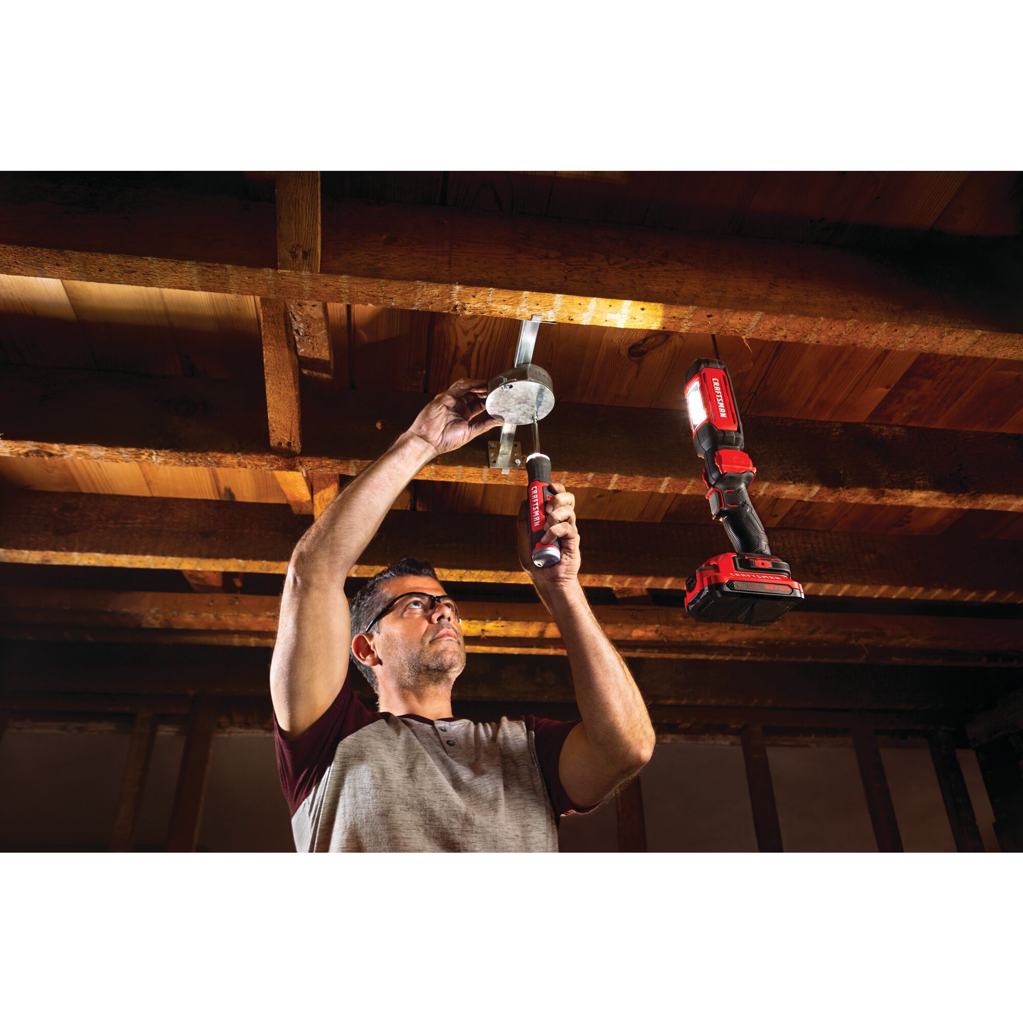 Cordless led hanging work light tool only being used for fixing things.
