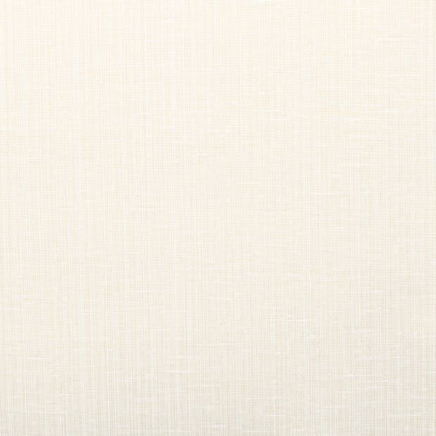 Cream-colored woven linen fabric (wallpaper or upholstery) occupying the frame, showing fine crosshatch texture; lying flat and evenly lit, serving as a neutral background with soft, warm lighting.