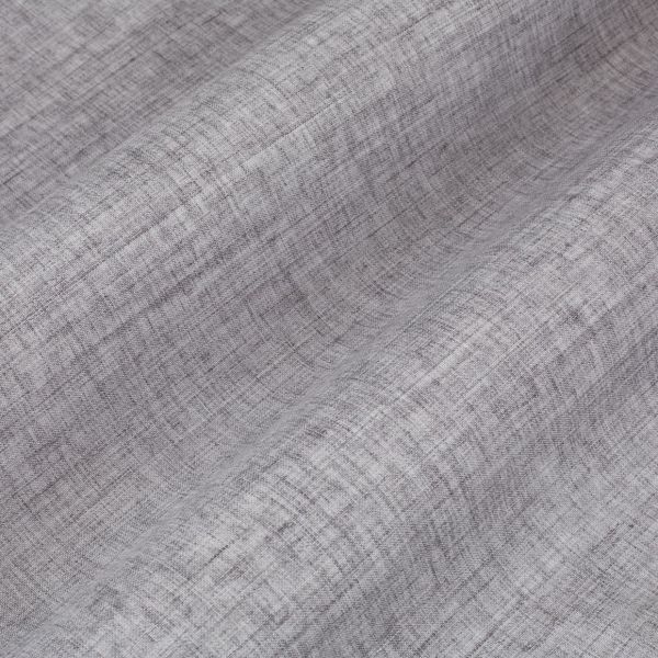 Grey textured curtain fabric, linen-like, draped in gentle vertical folds, showing a crosshatch weave; soft light highlights subtle shading and texture in a close-up studio setting.