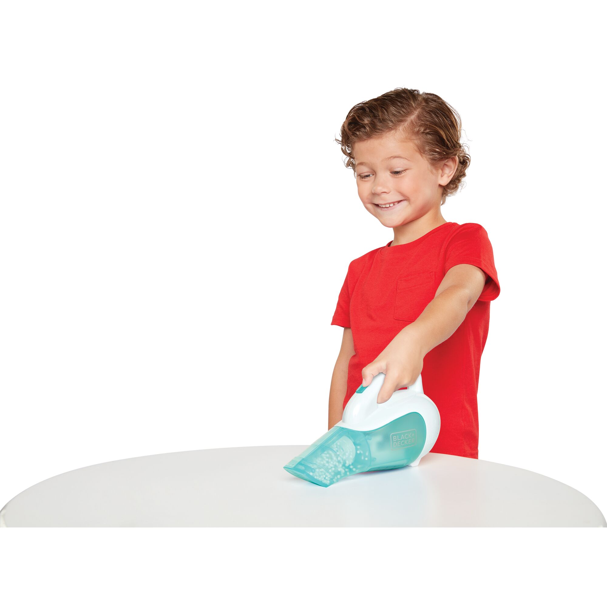 Junior toy dustbuster being used by a child.