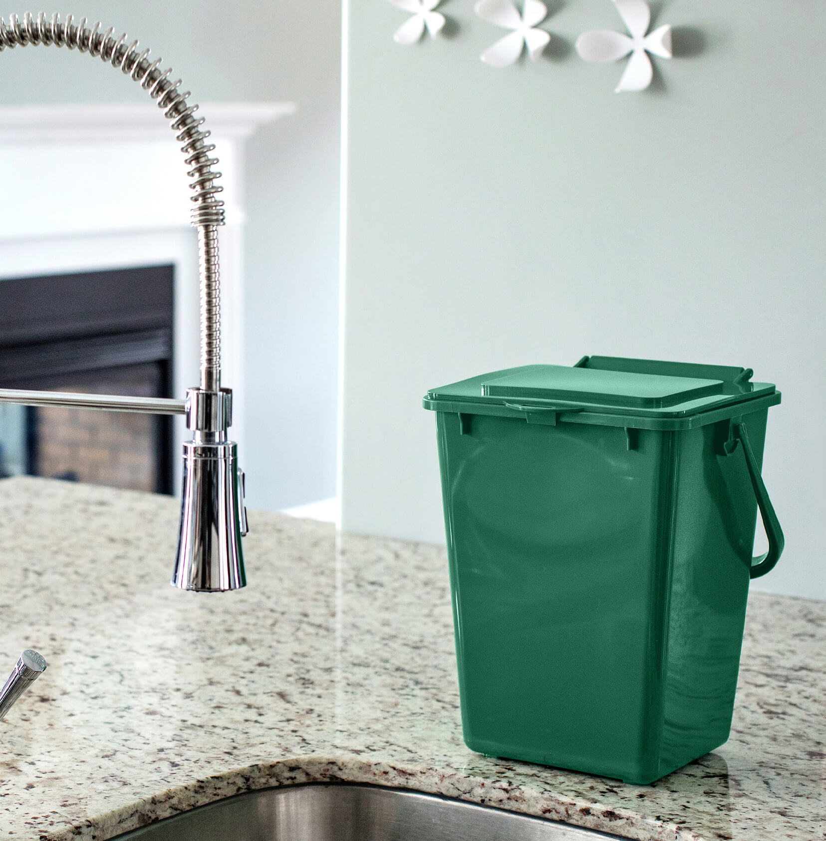 kitchen composter bin made from 100% PCR plastic sitting on the counter of an upscale home kitchen