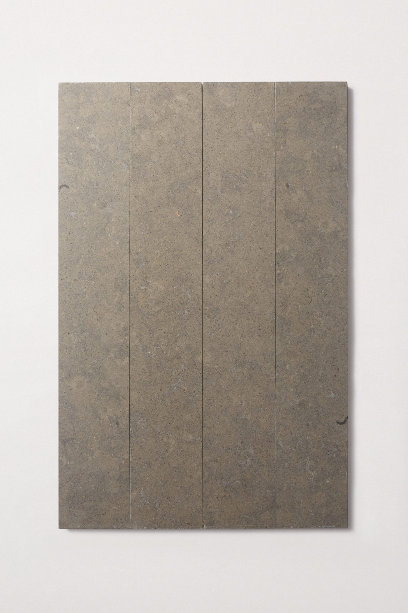 a rectangle grey tile on a white surface.