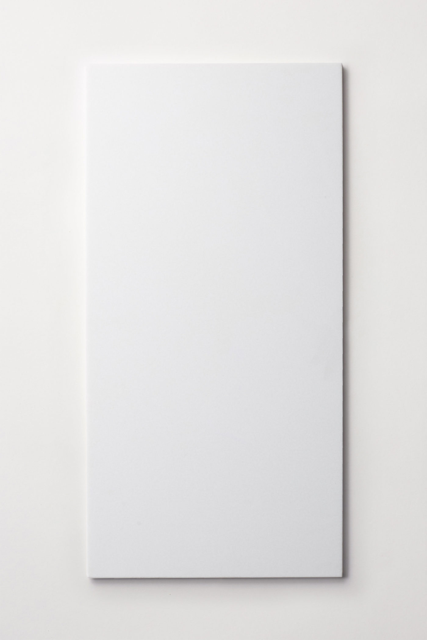 a white rectangle tile on a white background.