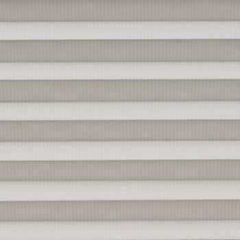 Horizontal pleated cellular shades fully lowered across the window, their alternating light-and-dark bands filtering soft daylight, filling a neutral-toned interior with diffused, even illumination.