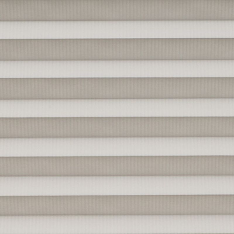 Horizontal pleated cellular shades fully lowered across the window, their alternating light-and-dark bands filtering soft daylight, filling a neutral-toned interior with diffused, even illumination.