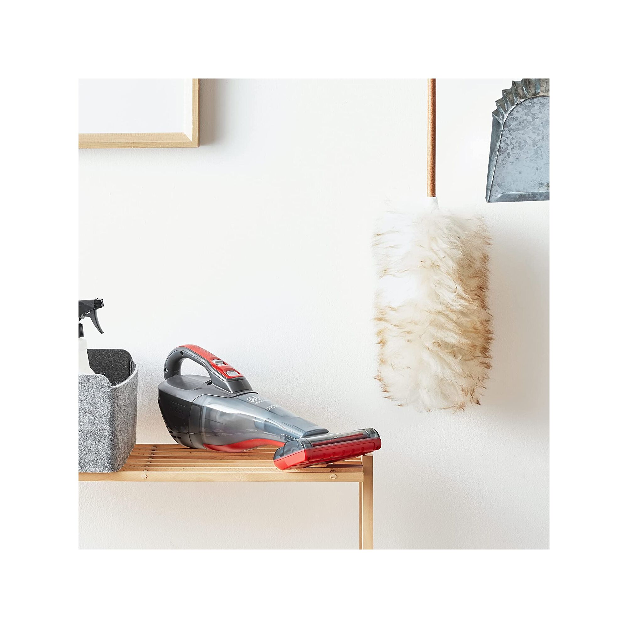 Dustbuster handheld vacuum sitting on a shelf in a utility room