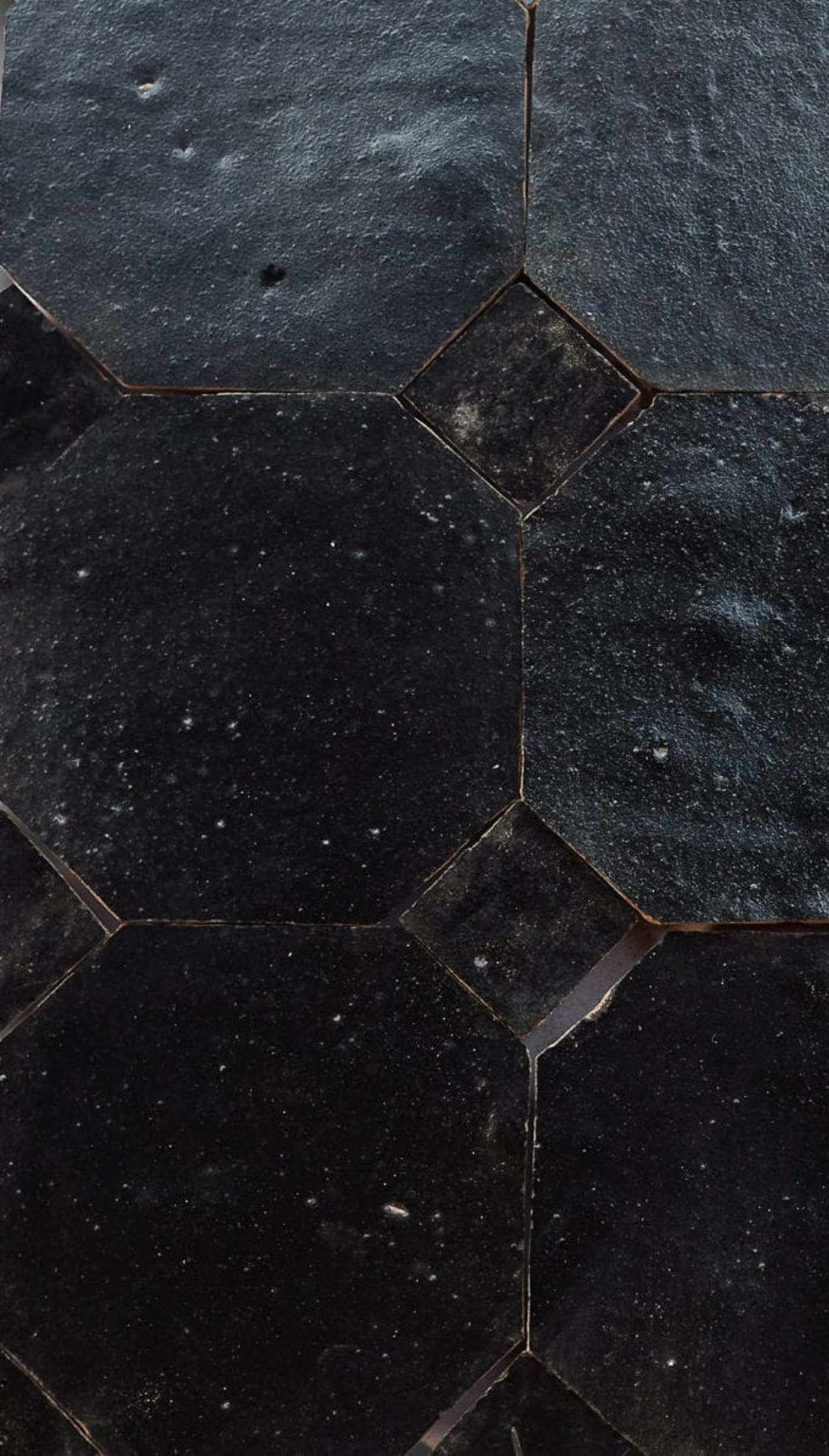 a close up of black tile.