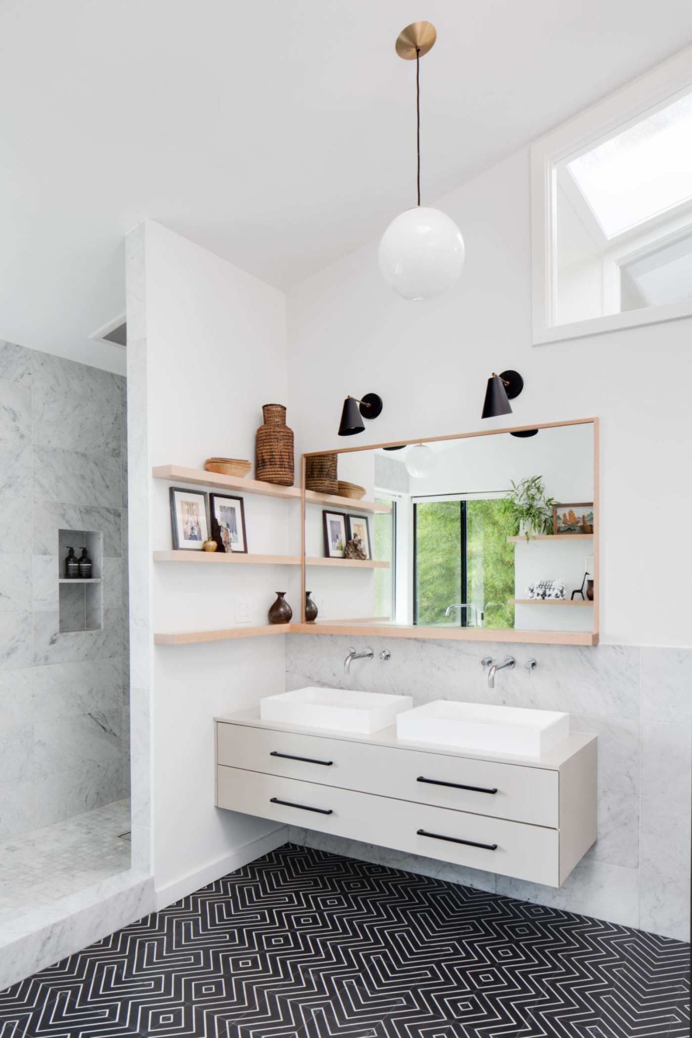 a bathroom with a black and white tile floor.