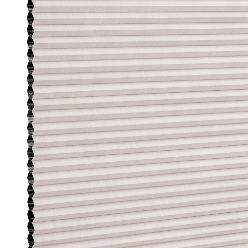 Cellular pleated window shade (honeycomb design) fully lowered, pale blush fabric with visible black cell openings at left edge, blocking light; close-up view against a neutral background.