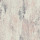 Abstract painted wall showing vertical streaks and distressed blotches in muted blush, gray-blue, and off-white, set against a subtle ribbed texture suggesting weathered plaster or wallpaper.
