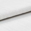 White textured fabric roll with coarse woven pattern; layered and slightly folded, resting overlapped on a matching textured surface in bright, diffuse studio lighting, close-up detail.