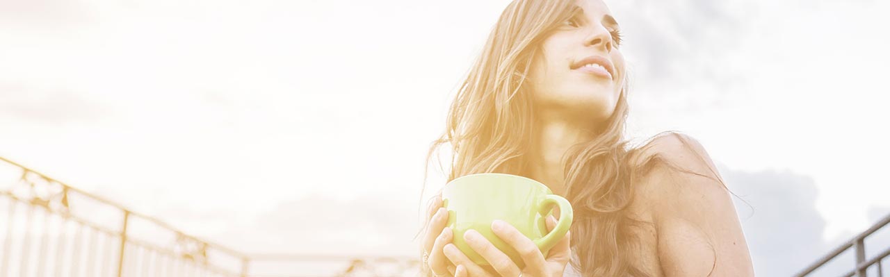 Woman Outside Holding a Tea Mug