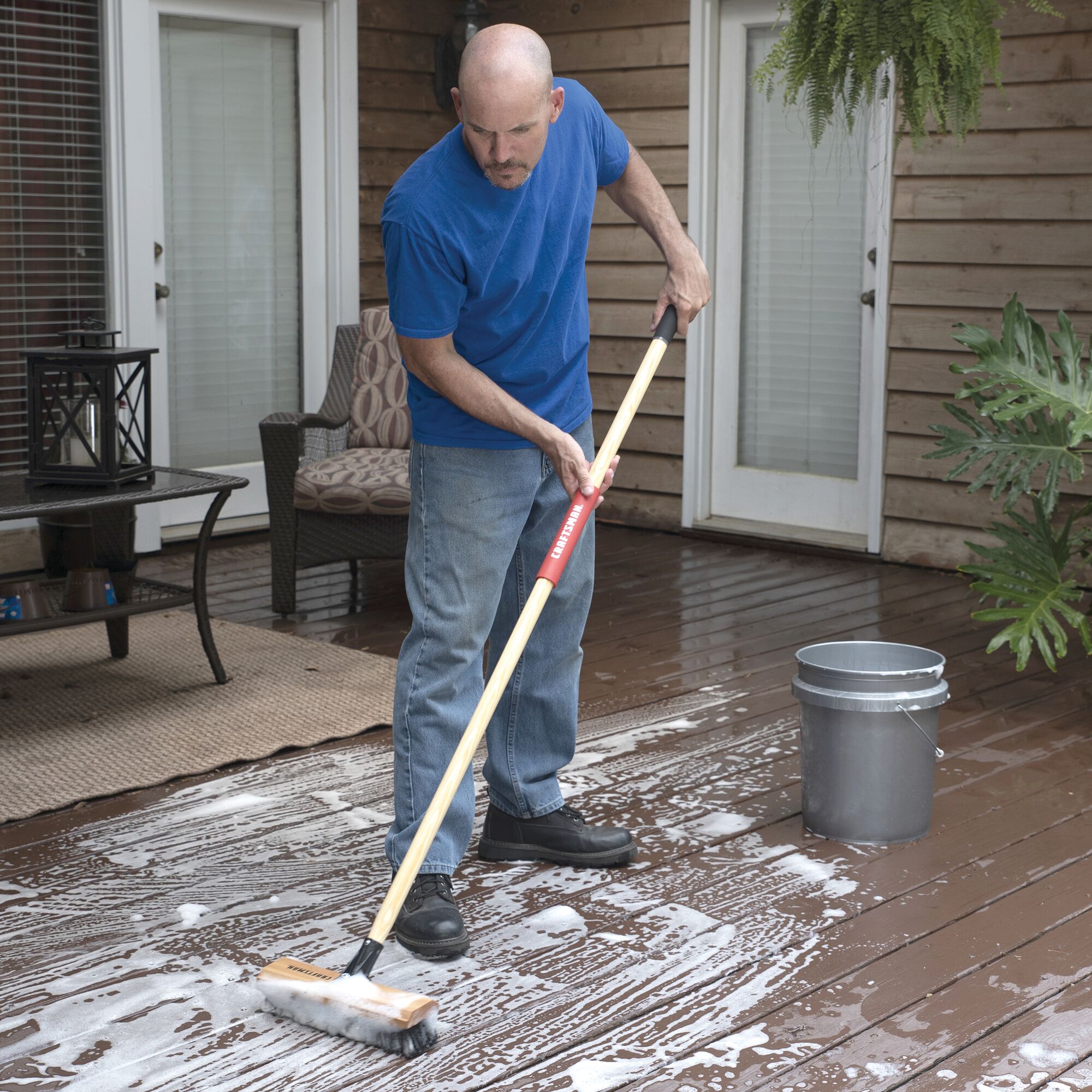 View of CRAFTSMAN 12-in Scrubbing Deck Brush being used by consumer