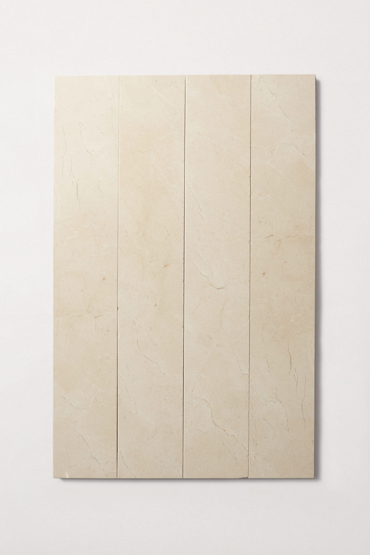 a beige marble tile on a white wall.