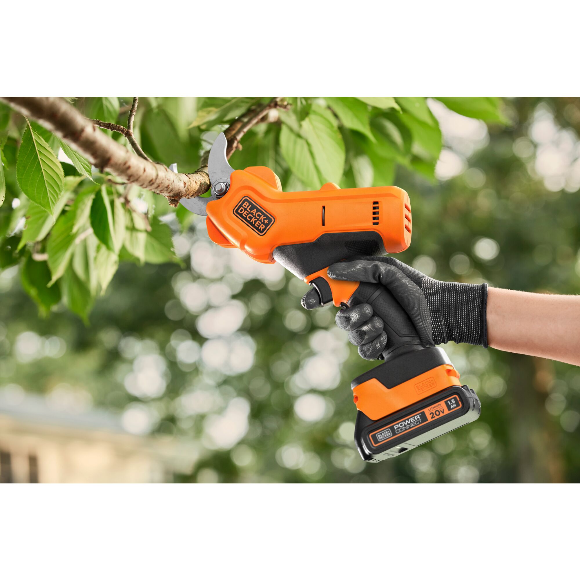 Person using 20V Max Cordless Pruner on a tree branch