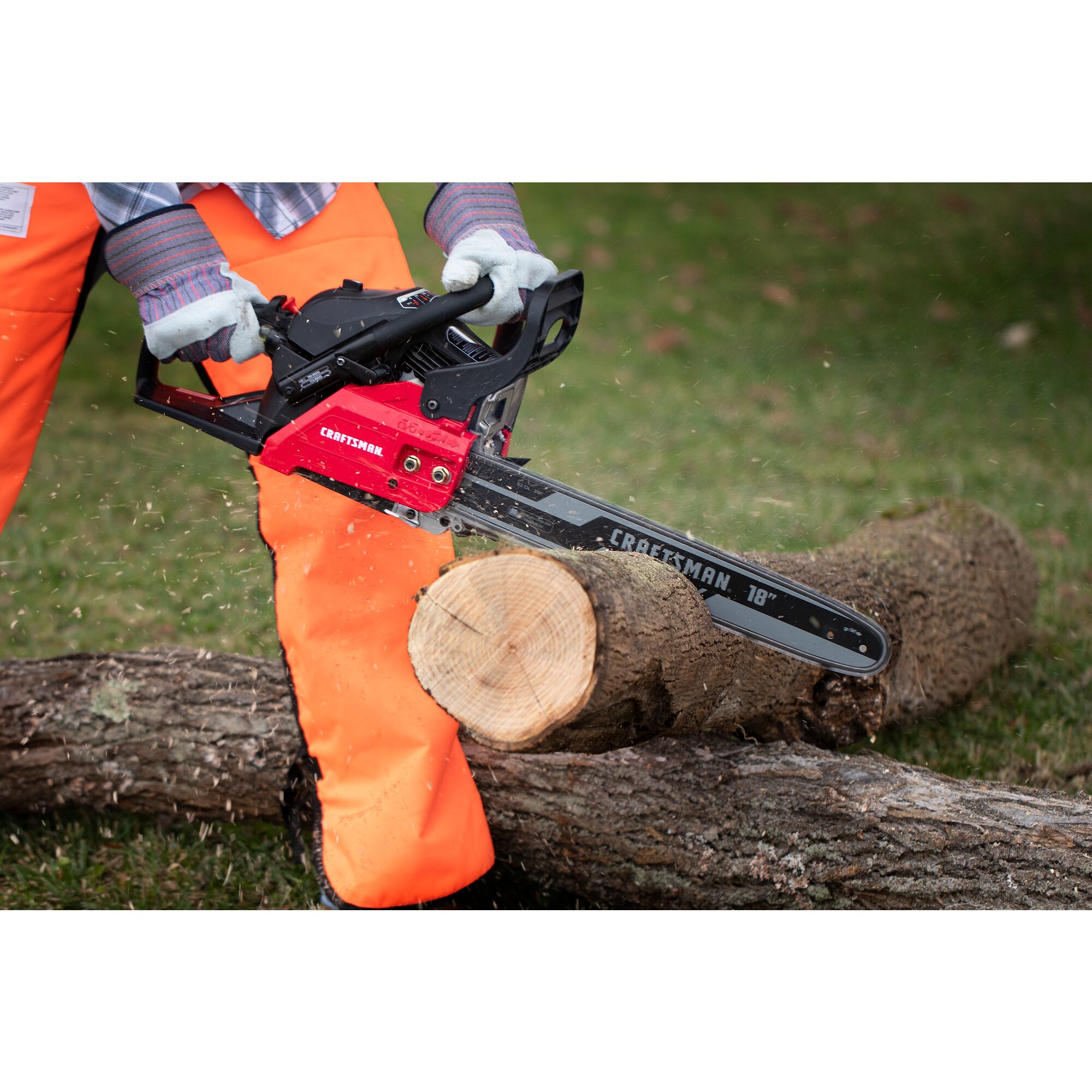 CRAFTSMAN S185 Gas Chainsaw cutting tree branches in yard in side view