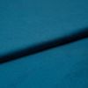 Teal satin fabric, folded diagonally with a soft sheen and subtle texture; fold casting a gentle shadow, close-up studio view with even lighting emphasizing the smooth surface.