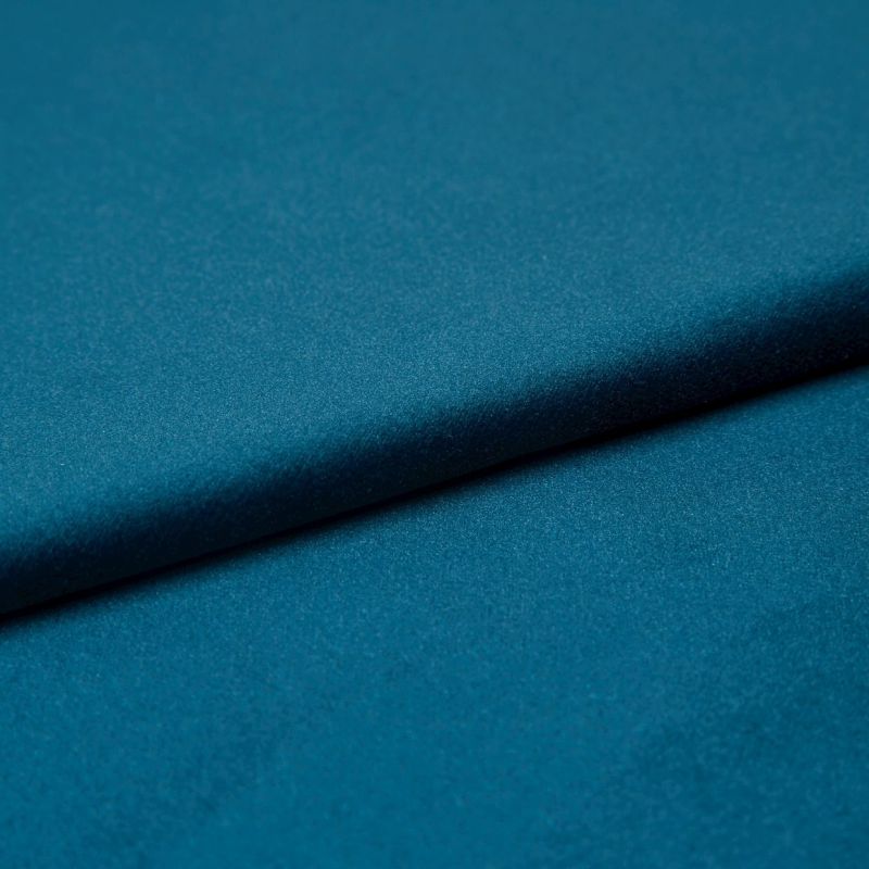 Teal satin fabric, folded diagonally with a soft sheen and subtle texture; fold casting a gentle shadow, close-up studio view with even lighting emphasizing the smooth surface.