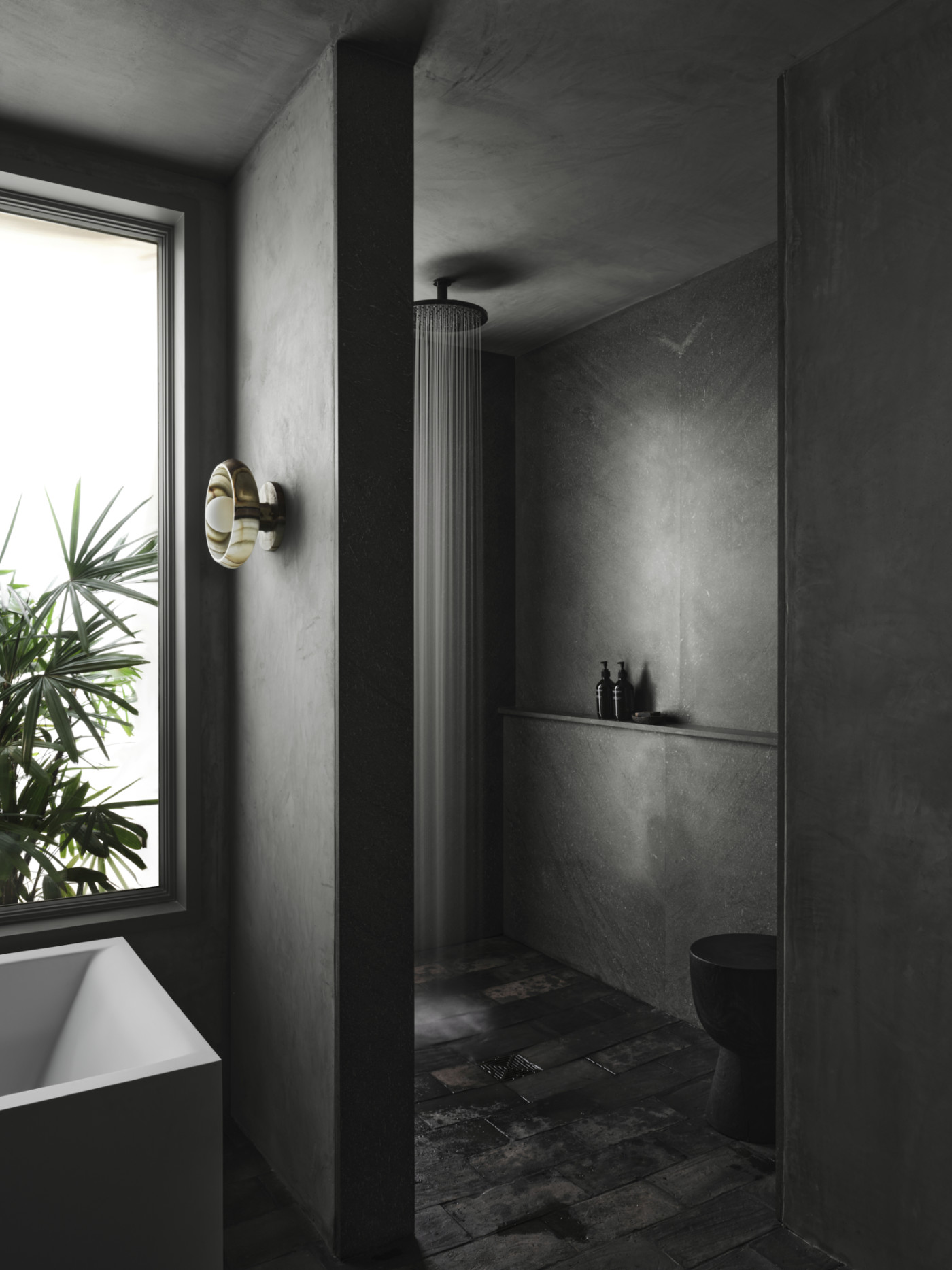 a black bathroom with a tub and a window.