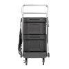 Flatbed utility dolly in dark gray with 5” casters and straps