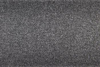 Fine-grained dark gray textured surface, densely speckled and rough, filling the entire frame; close-up macro view with even diffuse lighting and no discernible surroundings.