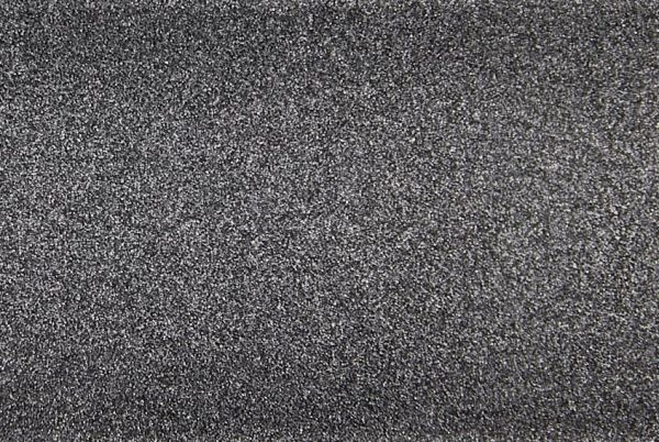 Fine-grained dark gray textured surface, densely speckled and rough, filling the entire frame; close-up macro view with even diffuse lighting and no discernible surroundings.