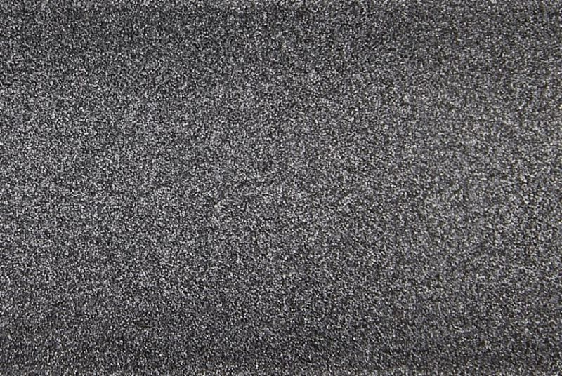 Fine-grained dark gray textured surface, densely speckled and rough, filling the entire frame; close-up macro view with even diffuse lighting and no discernible surroundings.