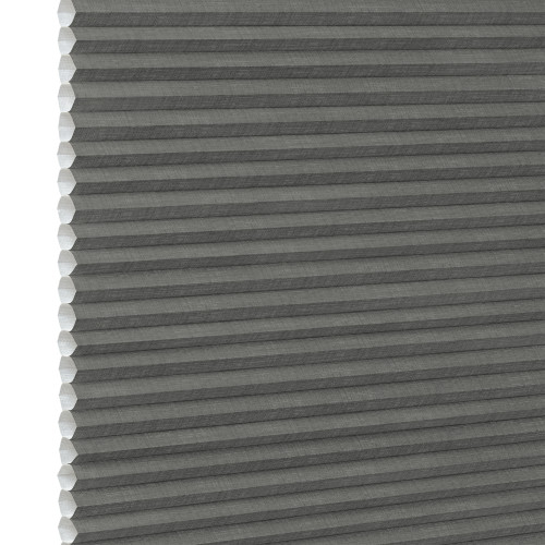 Gray cellular (honeycomb) pleated blind, fully lowered and closed, blocking light; close-up interior view showing textured fabric and white left-side gap under neutral lighting.