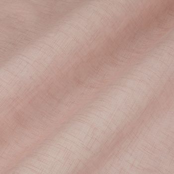 Sheer dusty-pink curtain with crosshatch linen texture, hanging in gentle vertical folds; soft, diffused light filters through, close-up view with no visible room beyond.