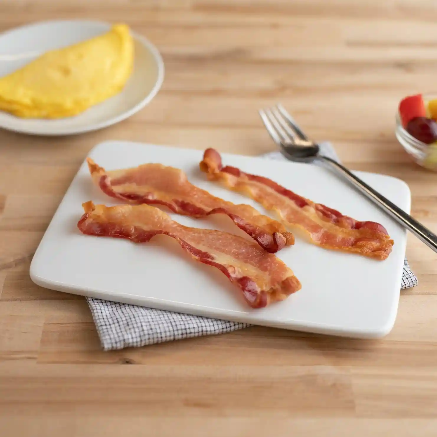 Wright® Brand Applewood Smoked Thin Sliced Honey Flavored Flat-Pack® Bacon, 15 lb, 10-12 Slices per Pound, Gas Flushed https://images.salsify.com/image/upload/s--wN7pPu_3--/q_25/e14d45be6d96f274a79b4fd4436a79066d463015.webp