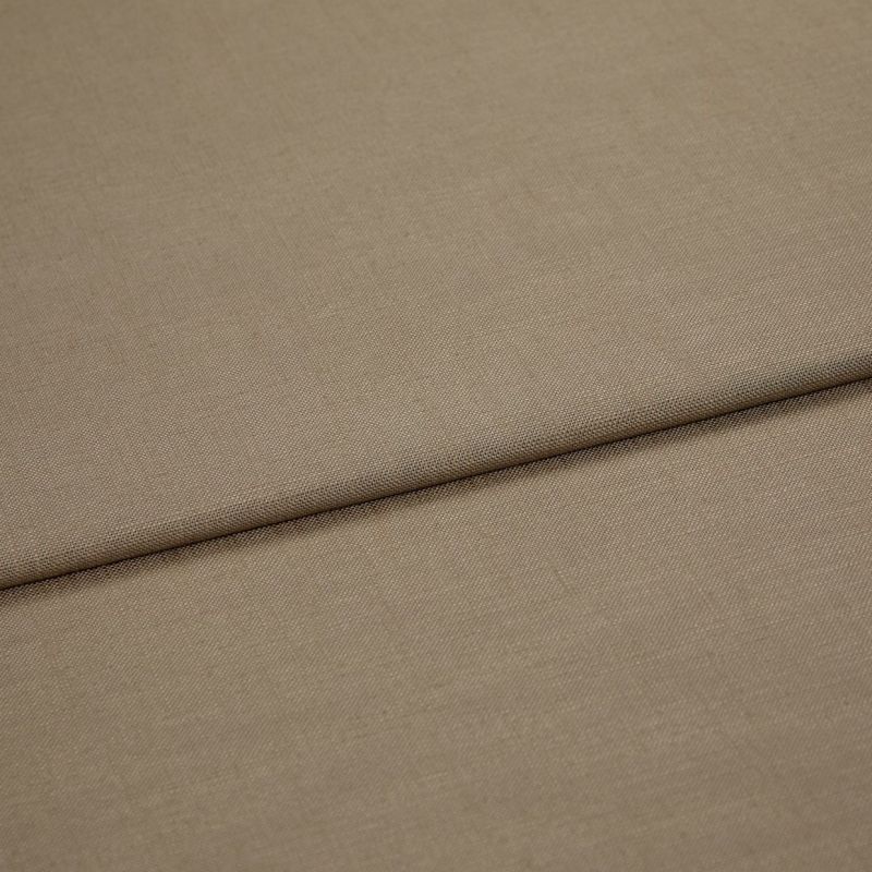 Beige woven fabric panel (textured) with a pronounced horizontal fold, folded over itself; close-up view showing fine weave, even neutral lighting and no visible surroundings.